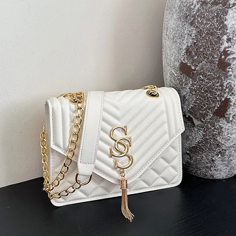 Glow Unbound LLC argyle quilted square crossbody bag