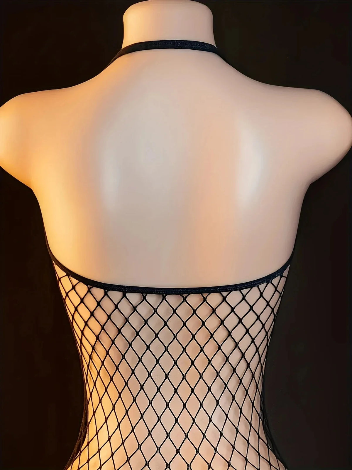 Back view of a mannequin wearing a lace strappy lingerie set one size, showcasing the delicate mesh fabric.