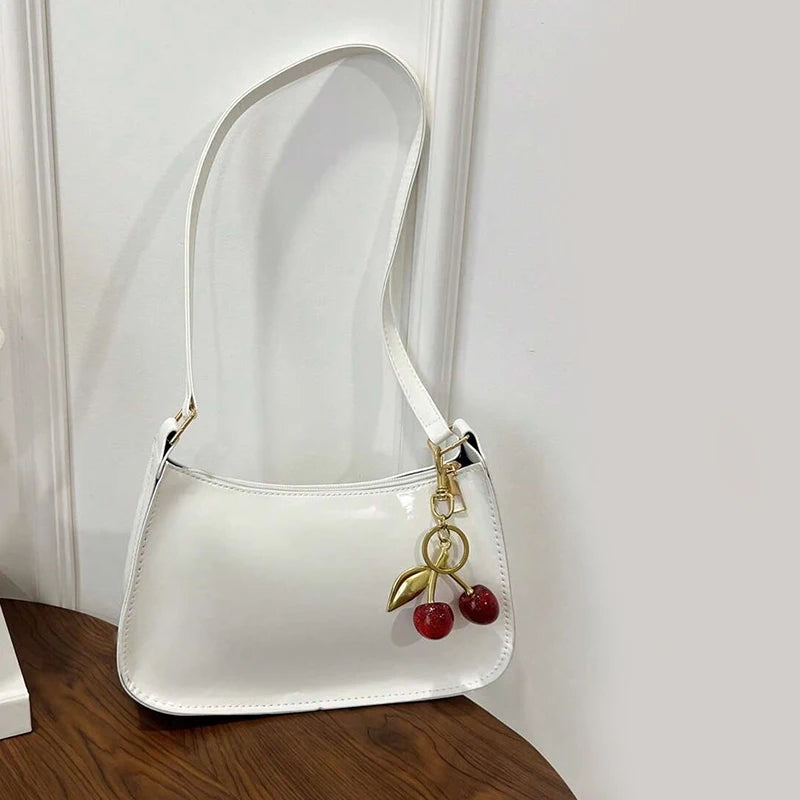Glow Unbound LLC PU leather cherry pendant shoulder bag