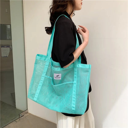 Glow Unbound LLC transparent mesh shoulder tote bag