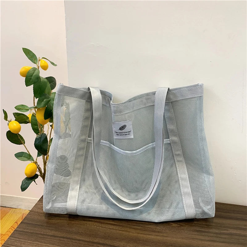 Glow Unbound LLC transparent mesh shoulder tote bag