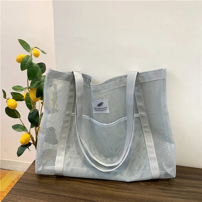 Glow Unbound LLC transparent mesh shoulder tote bag