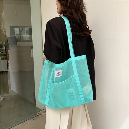 Glow Unbound LLC transparent mesh shoulder tote bag