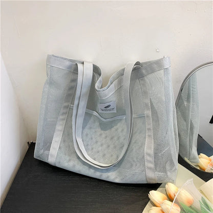 Glow Unbound LLC transparent mesh shoulder tote bag