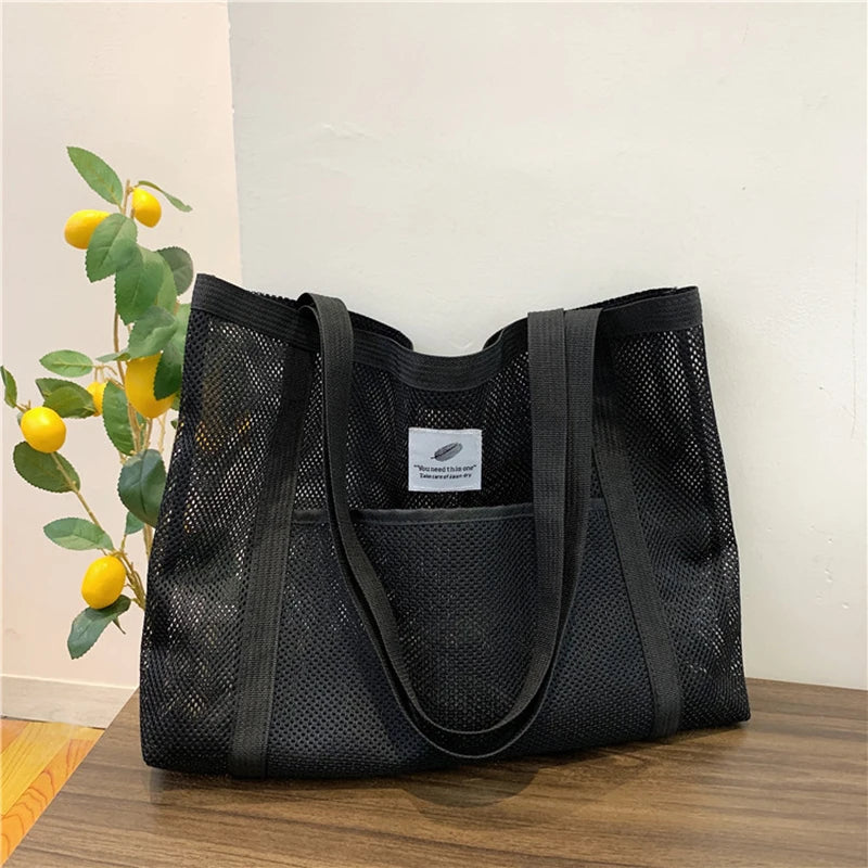 Glow Unbound LLC transparent mesh shoulder tote bag