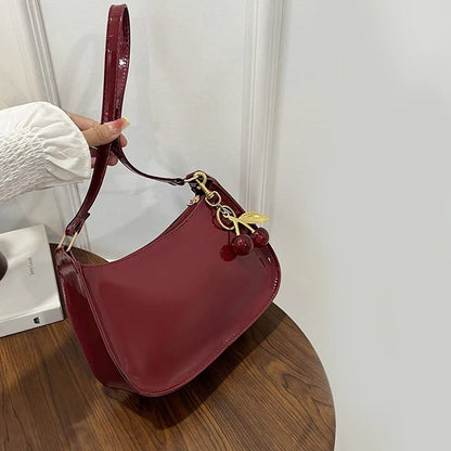 Glow Unbound LLC PU leather cherry pendant shoulder bag