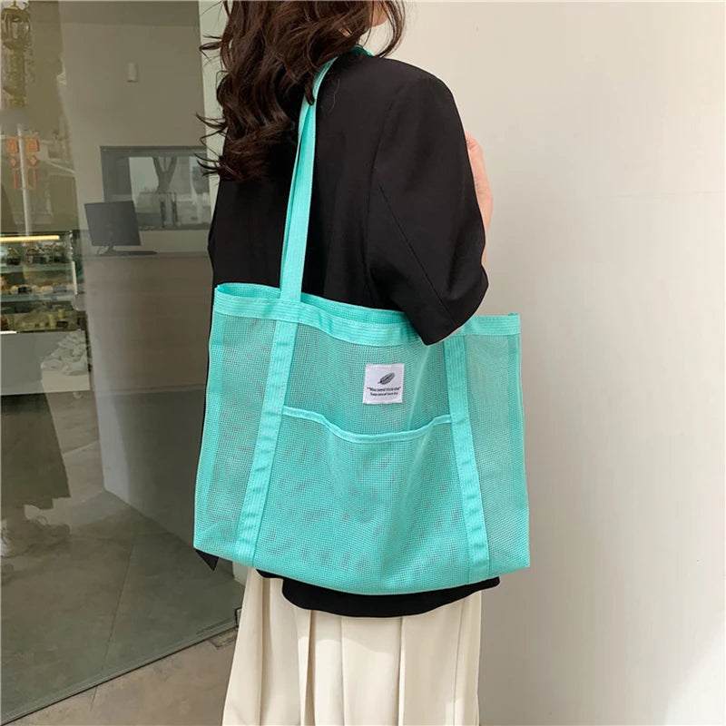 Glow Unbound LLC transparent mesh shoulder tote bag